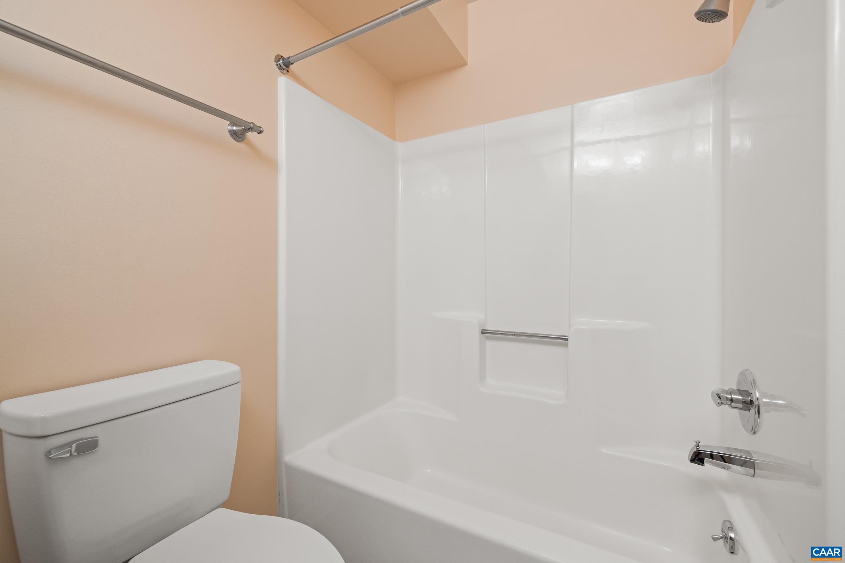 127 Turtle Creek Road, Unit 12 Charlottesville, VA 22901 - Photo 21 of 33 a white toilet sitting next to a bath tub