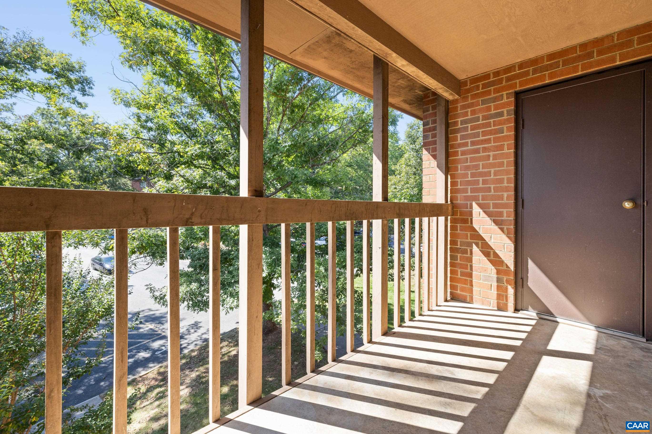 127 Turtle Creek Road, Unit 12 Charlottesville, VA 22901 - Photo 23 of 33 a view of a balcony with wooden floor