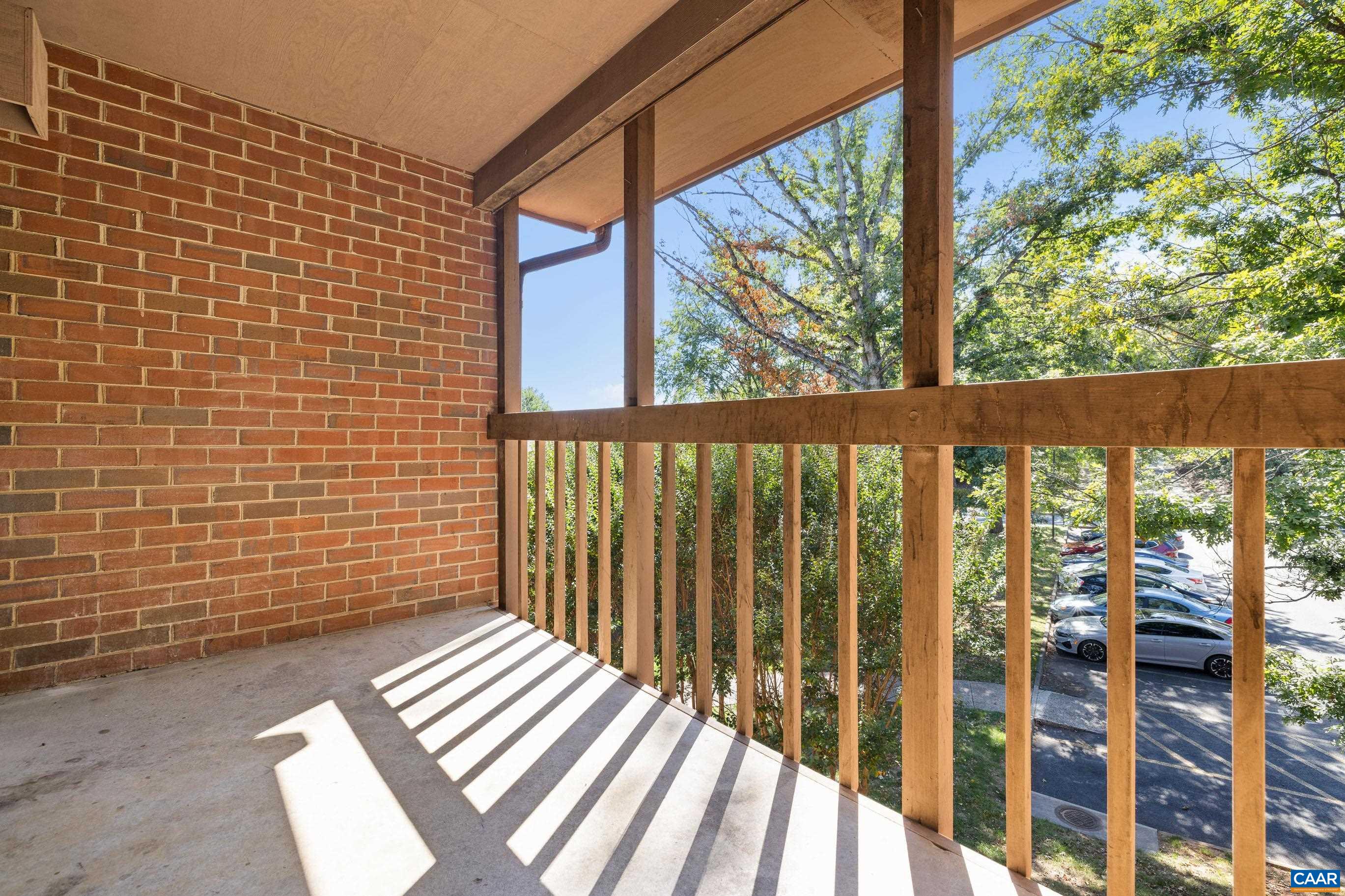 127 Turtle Creek Road, Unit 12 Charlottesville, VA 22901 - Photo 25 of 33 a view of a balcony with wooden floor