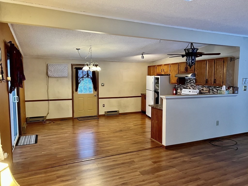 419 Lyons Hill Road Athol, MA 01331 - Photo 8 of 22 a view of a kitchen with a sink and a refrigerator