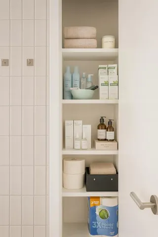 a shelf with books and knick knacks on it