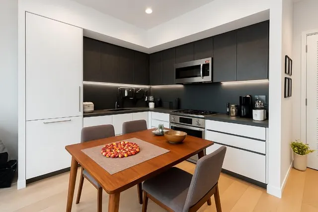a kitchen with a table and chairs in it