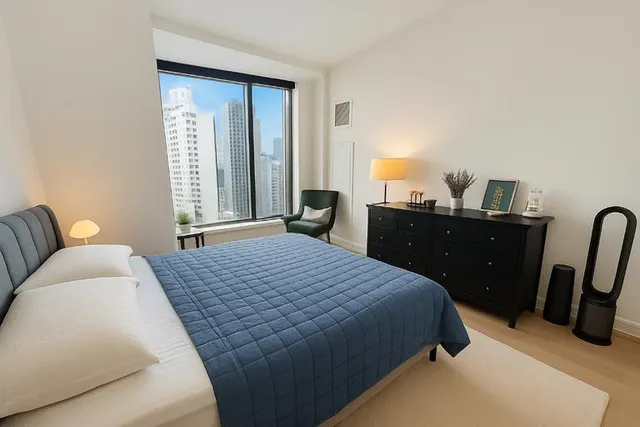 a bedroom with a bed and furniture