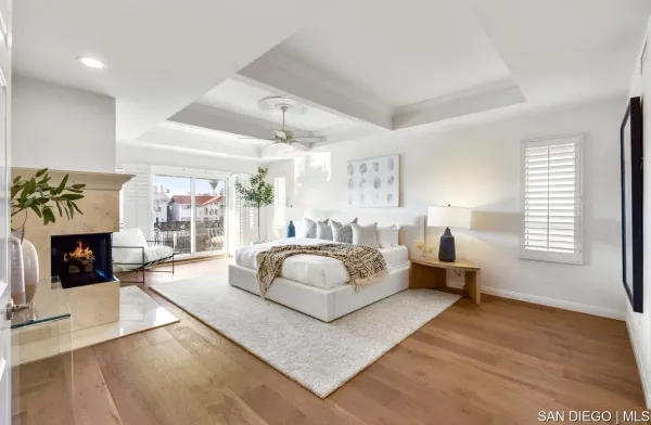 a spacious bedroom with a large bed and a fireplace