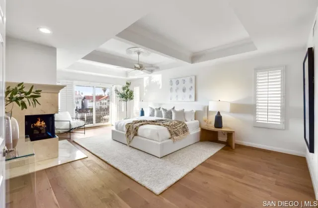 a spacious bedroom with a large bed and a fireplace