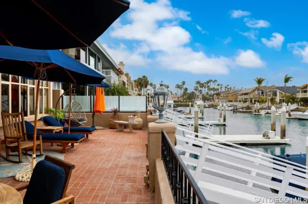 a roof deck view with a barbeque grill and couches