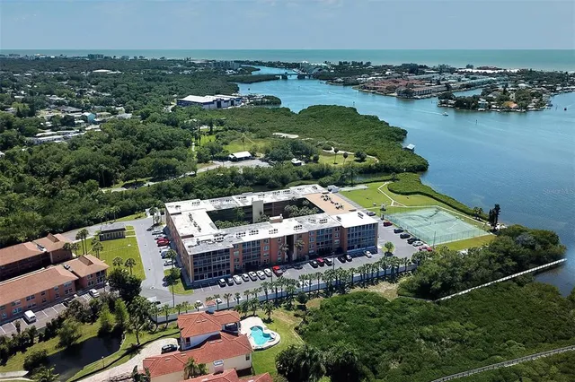 an aerial view of a house with a lake view