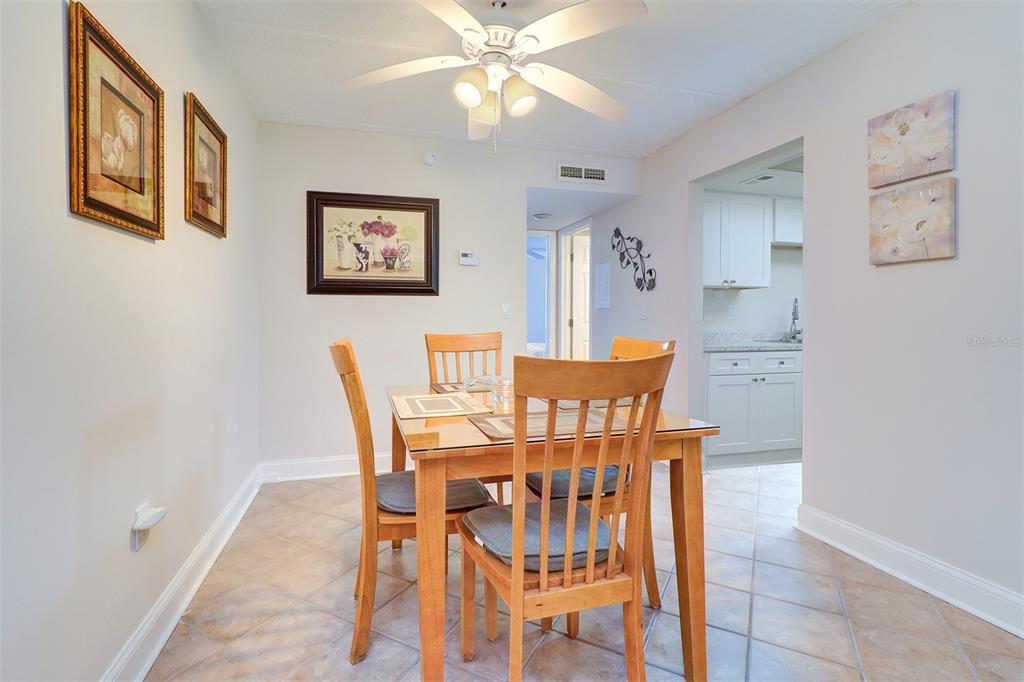 12760 Indian Rocks Road, Unit 1004 Largo, FL 33774 - Photo 11 of 45 a dining room with furniture and window