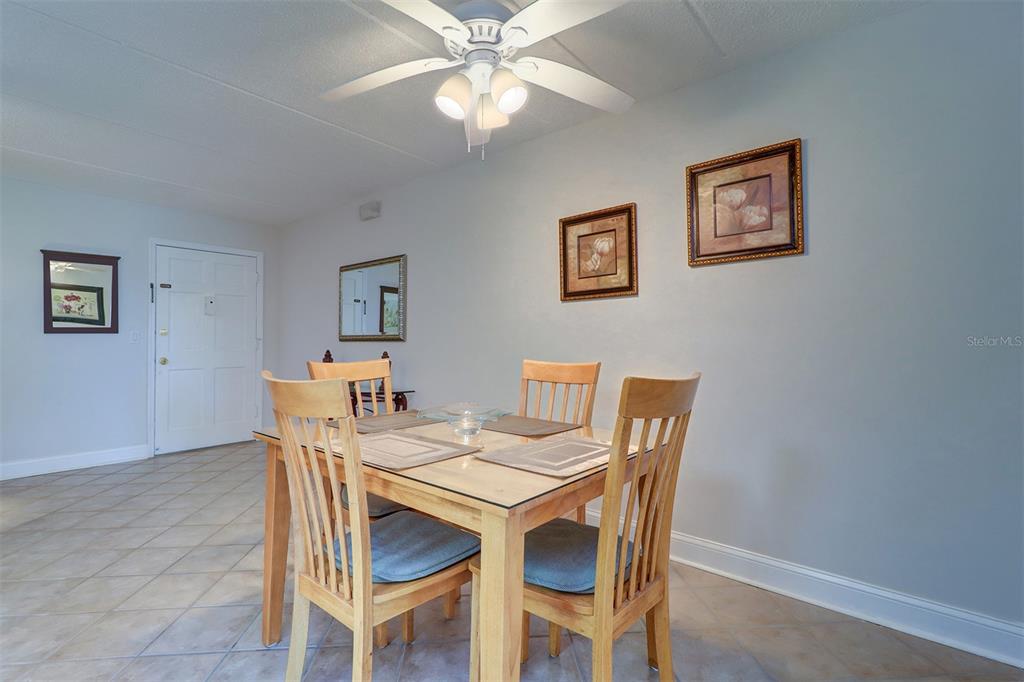 12760 Indian Rocks Road, Unit 1004 Largo, FL 33774 - Photo 12 of 45 a view of a dining room with furniture