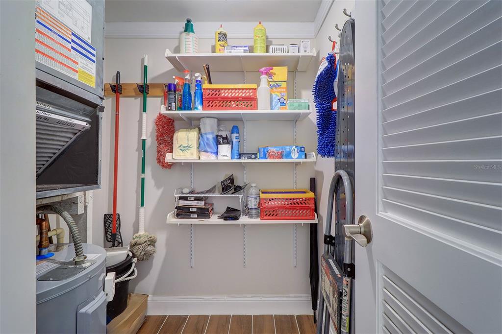12760 Indian Rocks Road, Unit 1004 Largo, FL 33774 - Photo 22 of 45 a view of walk in closet with clothes and shoes
