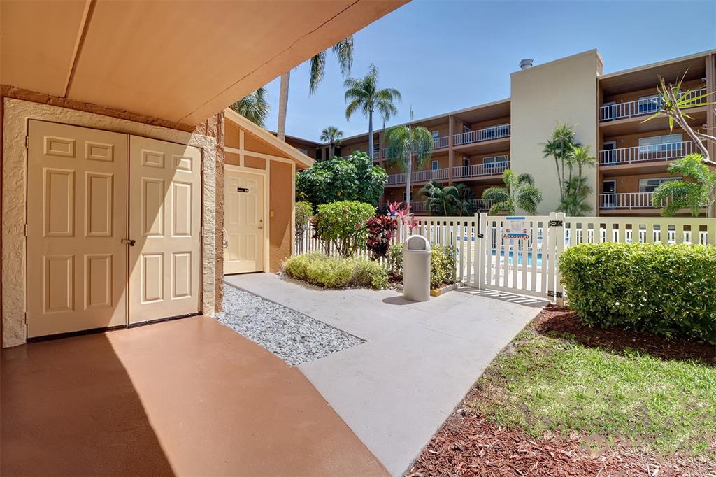 12760 Indian Rocks Road, Unit 1004 Largo, FL 33774 - Photo 24 of 45 a front view of a house having yard