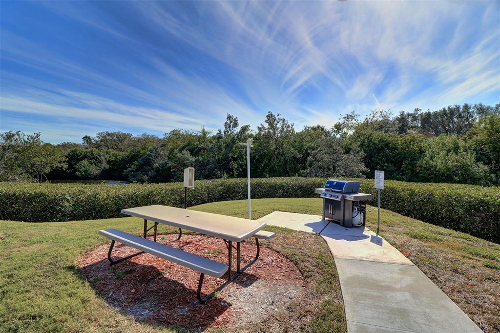 12760 Indian Rocks Road, Unit 1004 Largo, FL 33774 - Photo 30 of 45 a view of a chairs and tables in the patio