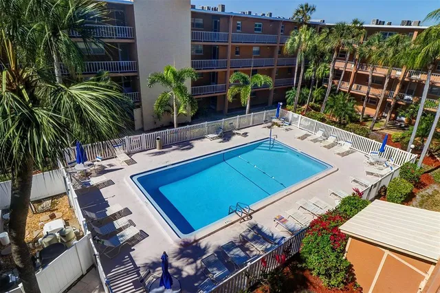 a view of a backyard with plants and a patio