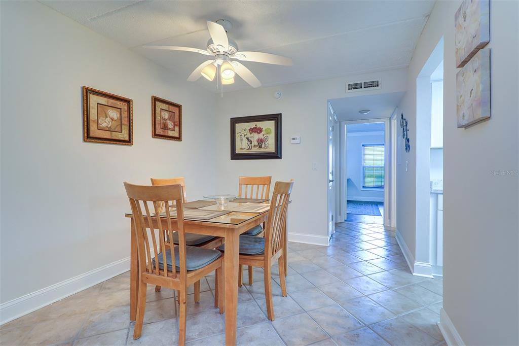 12760 Indian Rocks Road, Unit 1004 Largo, FL 33774 - Photo 10 of 45 a view of a dining room with furniture
