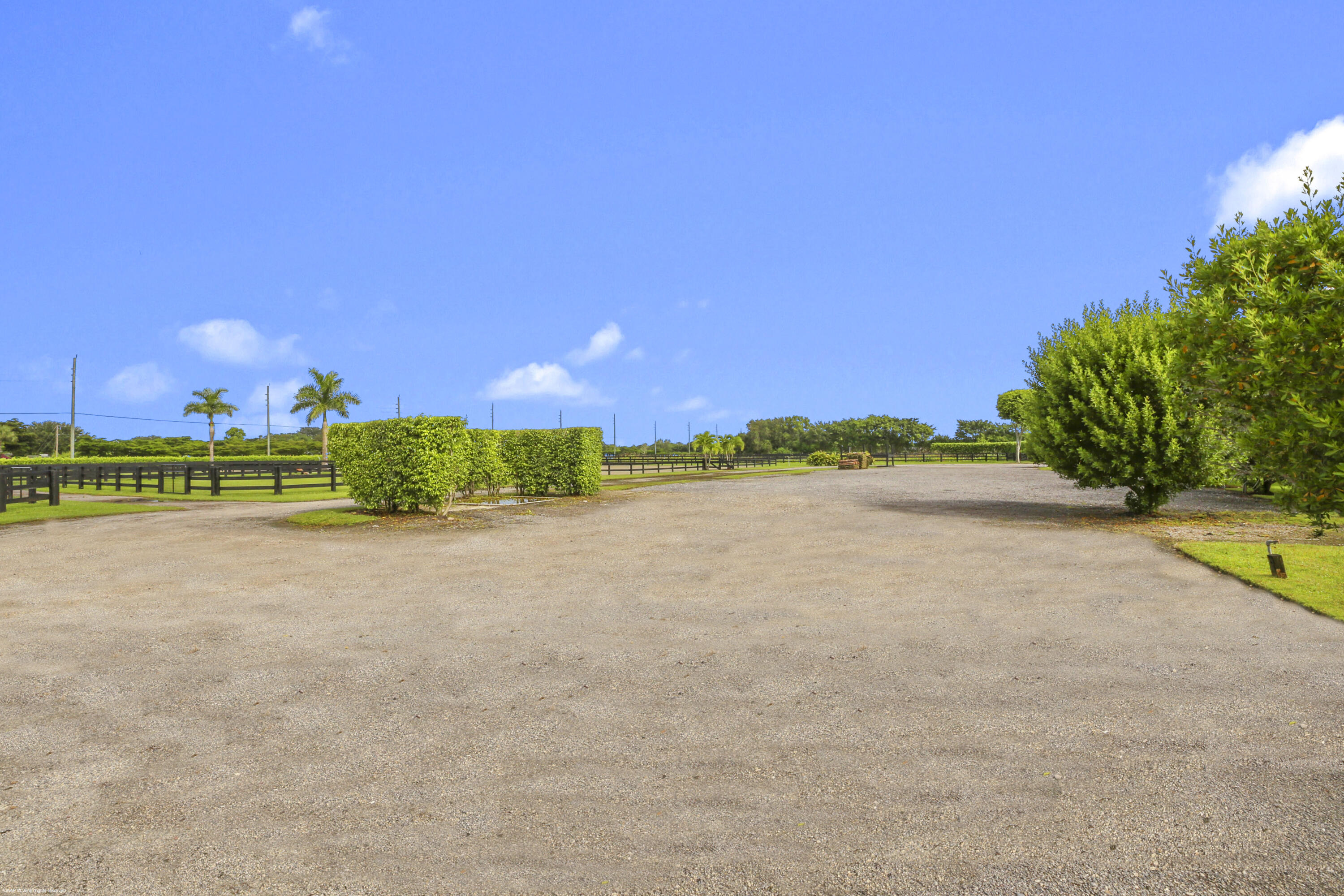 3899 Shutterfly Way Wellington, FL 33414 - Photo 12 of 27 a view of a lake with a house