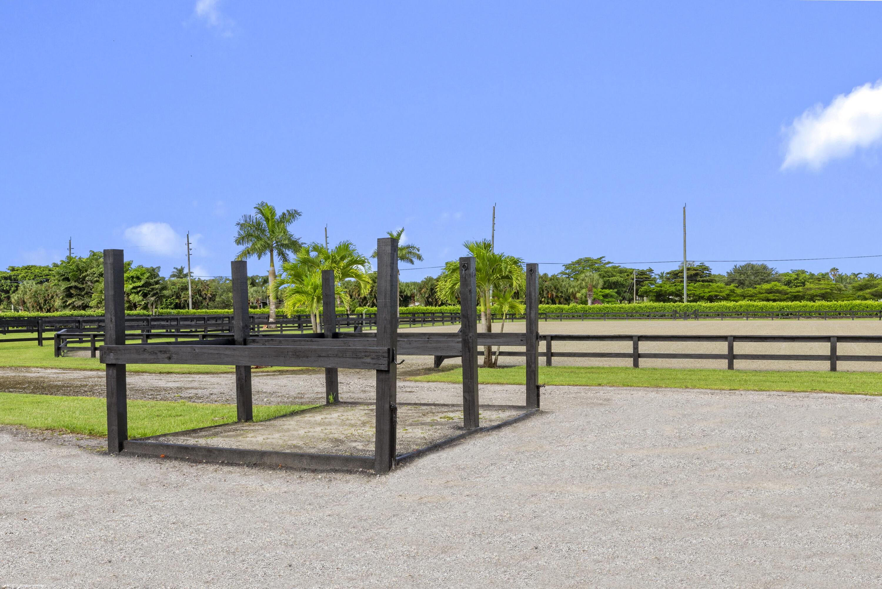 3899 Shutterfly Way Wellington, FL 33414 - Photo 13 of 27 a view of a park with large trees
