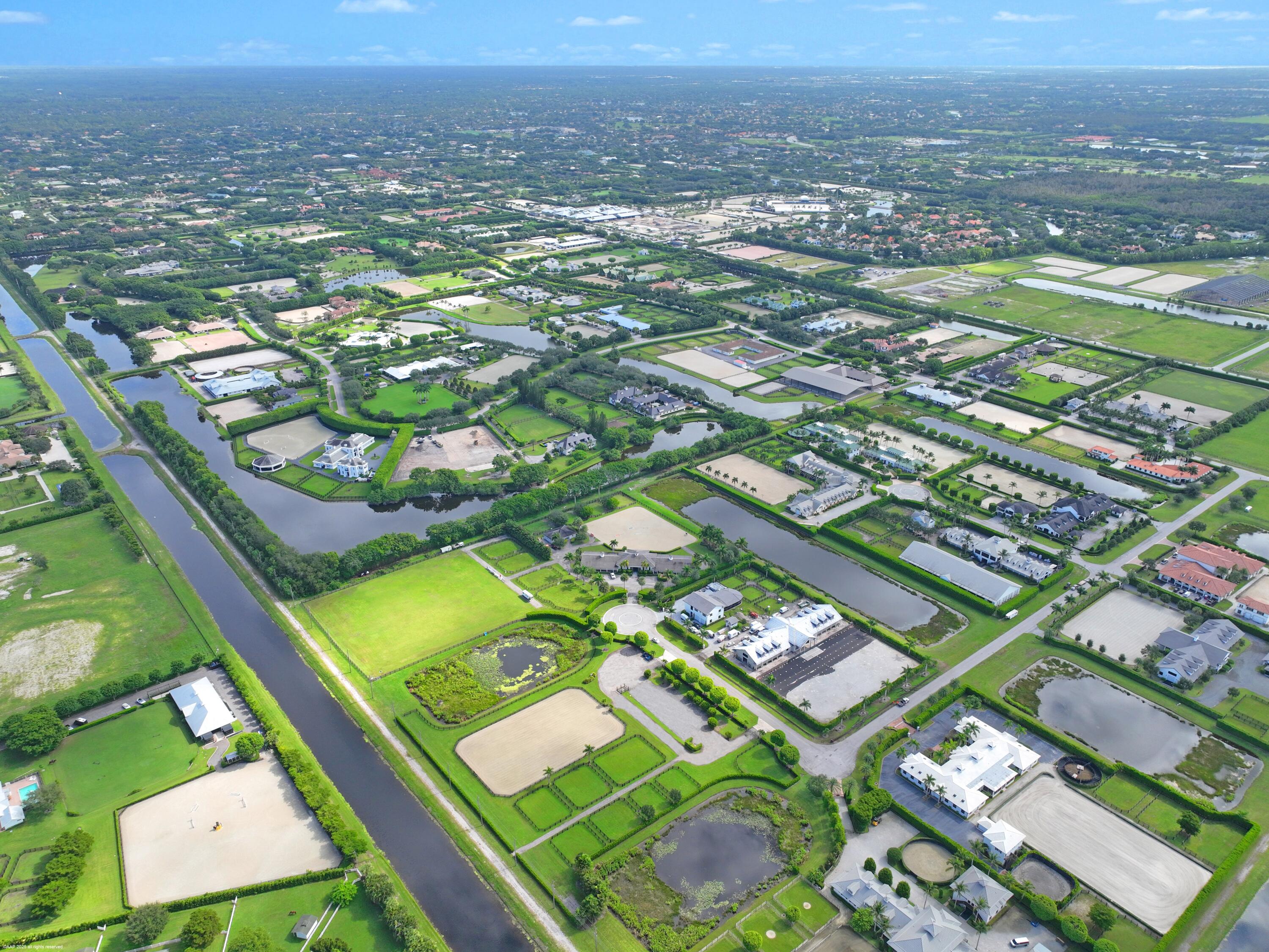 3899 Shutterfly Way Wellington, FL 33414 - Photo 19 of 27 an aerial view of residential houses with outdoor space