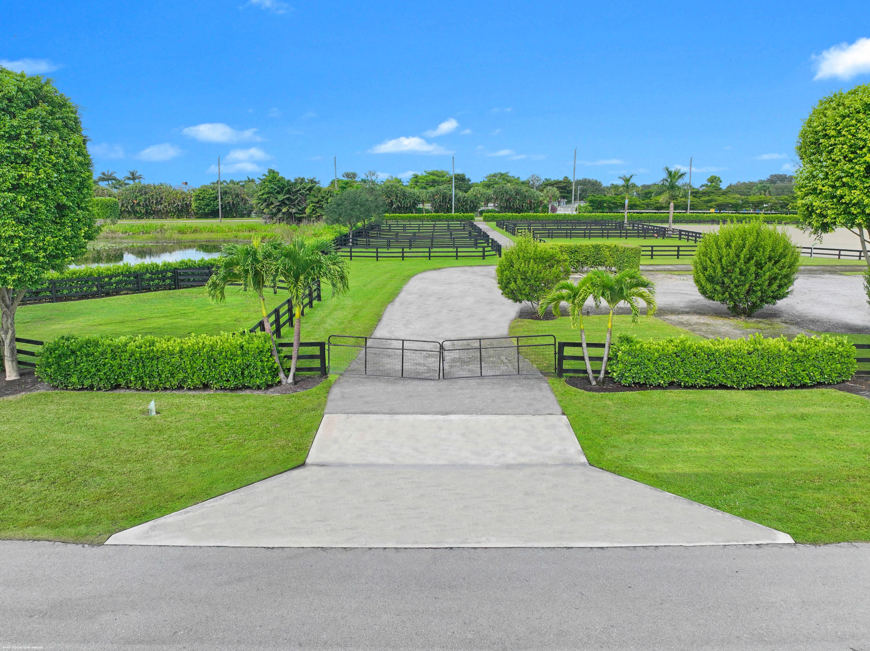 3899 Shutterfly Way Wellington, FL 33414 - Photo 2 of 27 a view of park with a yard