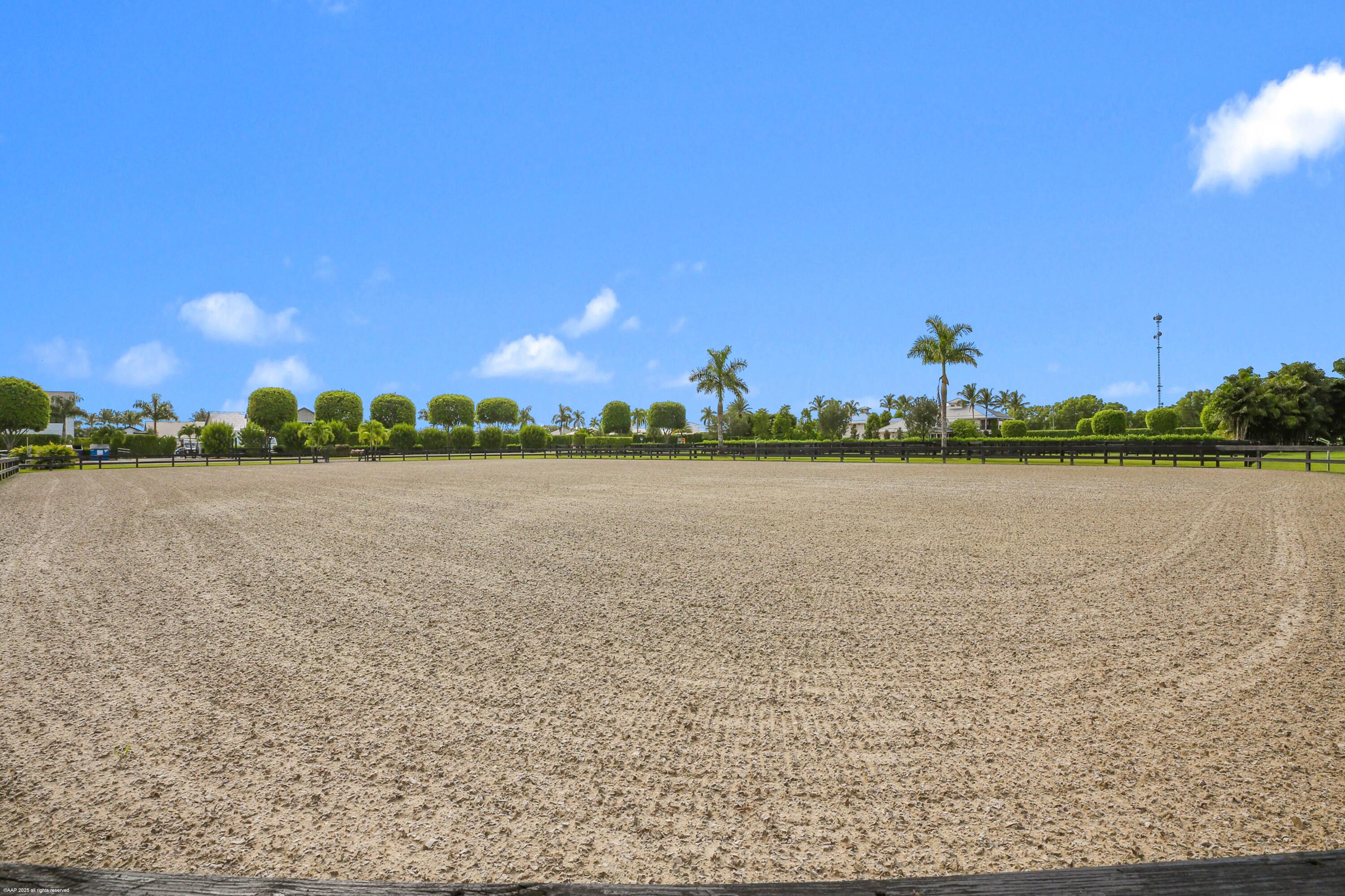 3899 Shutterfly Way Wellington, FL 33414 - Photo 8 of 27 a view of a lake with houses in the background