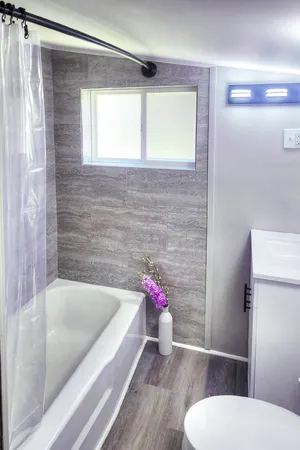 a bathroom with a sink toilet and bathtub