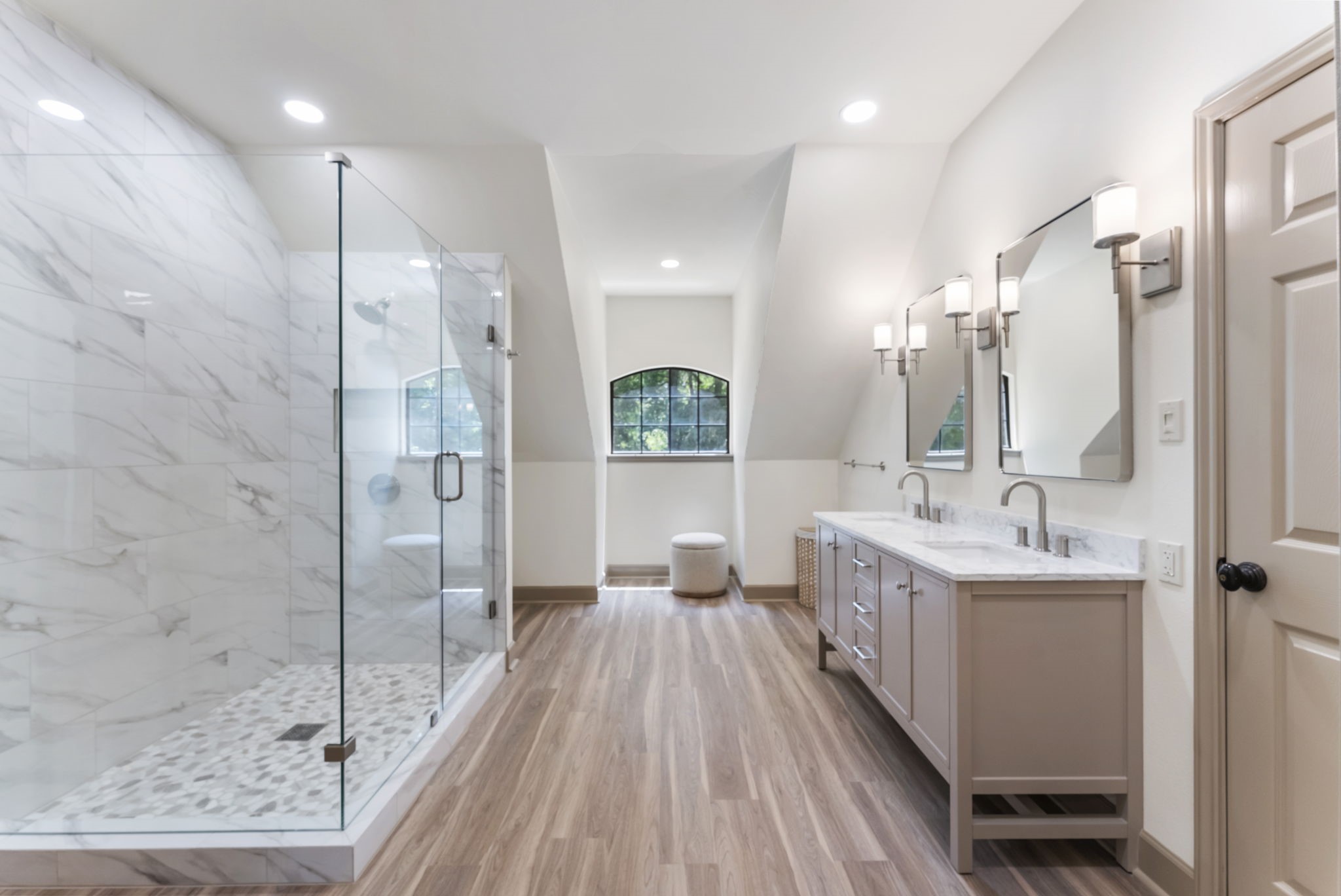 24311 Standing Oak Drive Spring, TX 77389 - Photo 24 of 42 The renovated full bath features a frameless glass shower, dual vanities, and marble-look tile for a spa-inspired feel. Tucked upstairs, it serves beautifully as part of a private second primary suite.