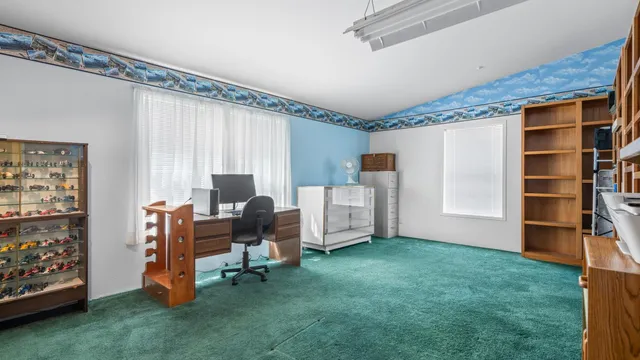 a workspace with furniture and window