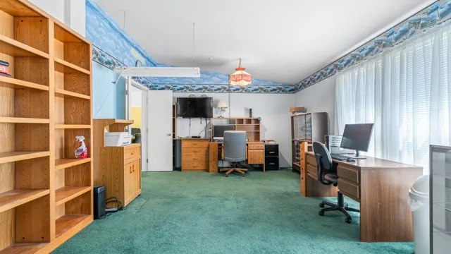 a view of a kitchen with workspace and a window