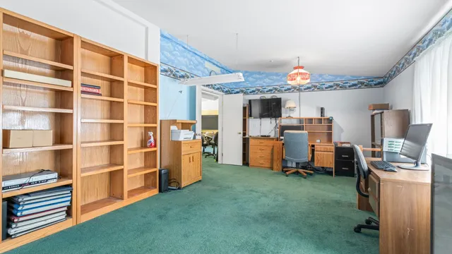 a bed room with furniture and a chandelier