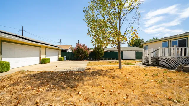 a view of a house with snow on the road