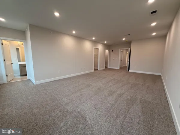a bathroom with a sink a shower a mirror and a bathtub