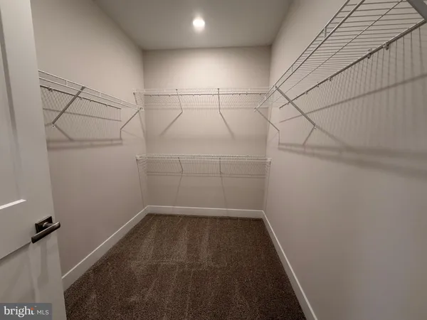 a view of a room with racks on the wall