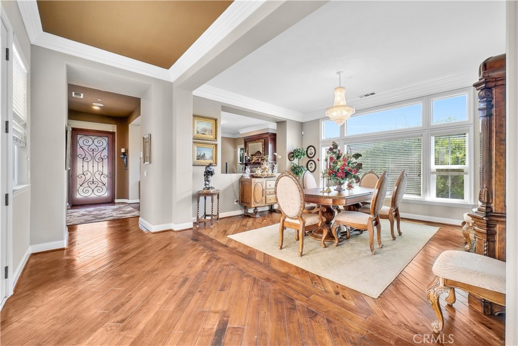 13123 Carriage Trail Court Rancho Cucamonga, CA 91739 - Photo 13 of 42 a view of a dining room with furniture and wooden floor