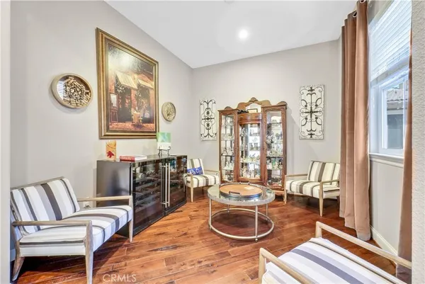 a living room with furniture and white walls