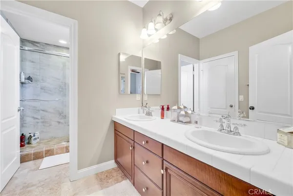 a white toilet sitting next to a bathroom sink