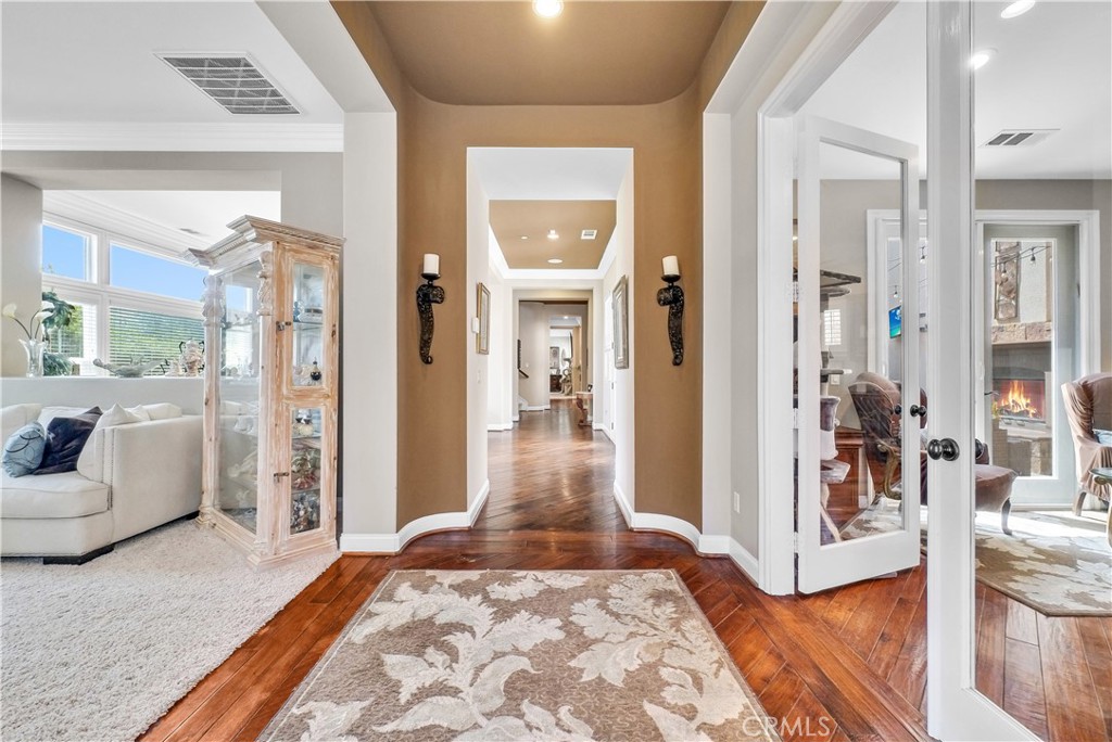 13123 Carriage Trail Court Rancho Cucamonga, CA 91739 - Photo 6 of 42 a living room with furniture and a rug
