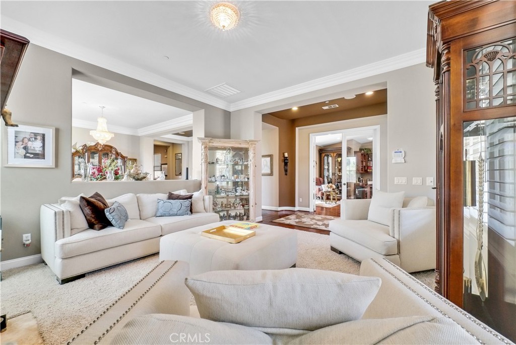 13123 Carriage Trail Court Rancho Cucamonga, CA 91739 - Photo 9 of 42 a living room with furniture and a large window