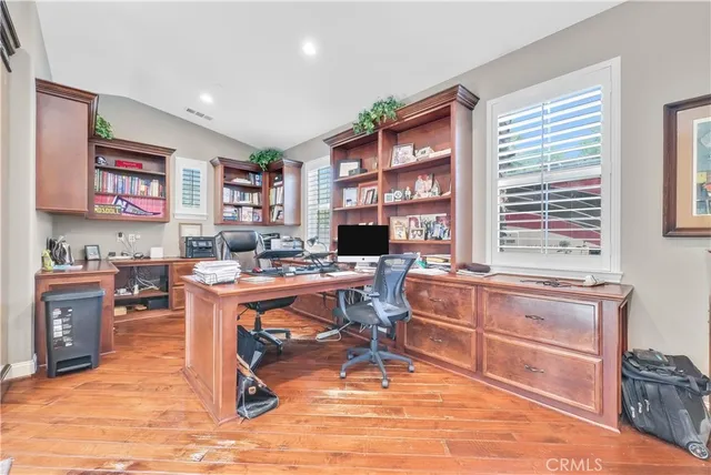 a living room filled with furniture and a large window