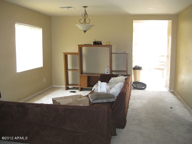 2849 East Bagdad Road San Tan Valley, AZ 85143 - Photo 12 of 17 a room with furniture and a window