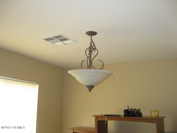2849 East Bagdad Road San Tan Valley, AZ 85143 - Photo 14 of 17 a view of a hallway with a chandelier and a window