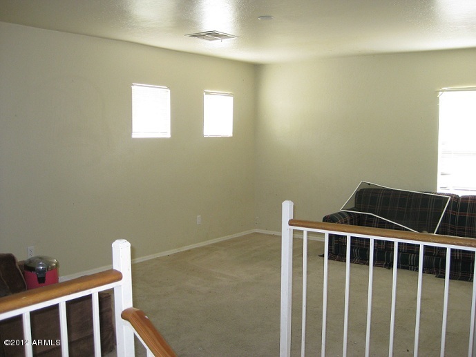 2849 East Bagdad Road San Tan Valley, AZ 85143 - Photo 15 of 17 a bedroom with a window