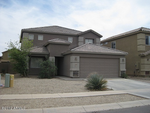 2849 East Bagdad Road San Tan Valley, AZ 85143 - Photo 2 of 17 a front view of a house with a garage