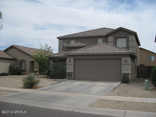 2849 East Bagdad Road San Tan Valley, AZ 85143 - Photo 3 of 17 a front view of a house with a garage
