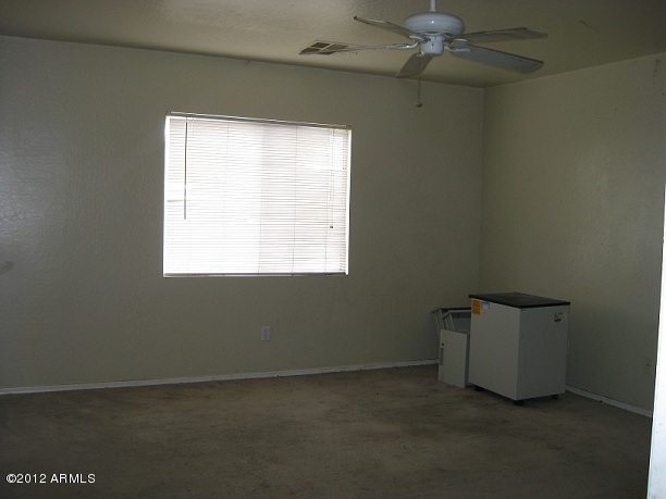 2849 East Bagdad Road San Tan Valley, AZ 85143 - Photo 6 of 17 an empty room with a window