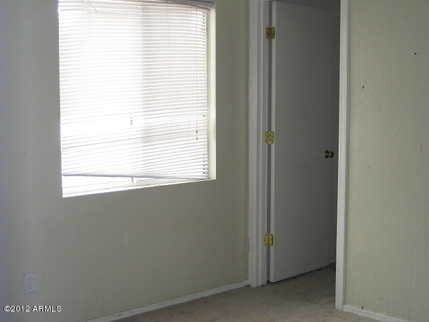 2849 East Bagdad Road San Tan Valley, AZ 85143 - Photo 10 of 17 a room that has a window in it