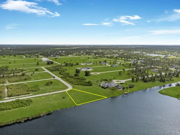 an aerial view of a golf course with parking space
