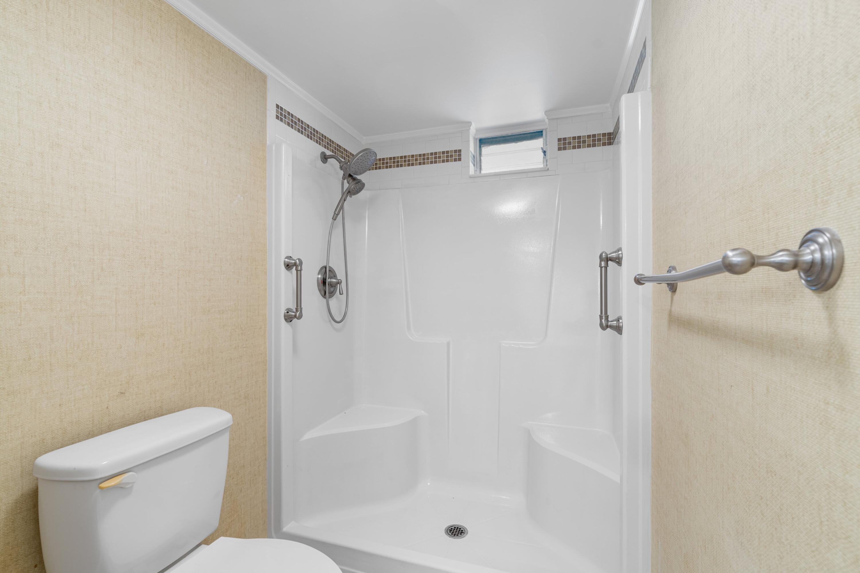 10693 North Military Trail, Unit 7 Palm Beach Gardens, FL 33410 - Photo 13 of 28 a bathroom with a shower and toilet