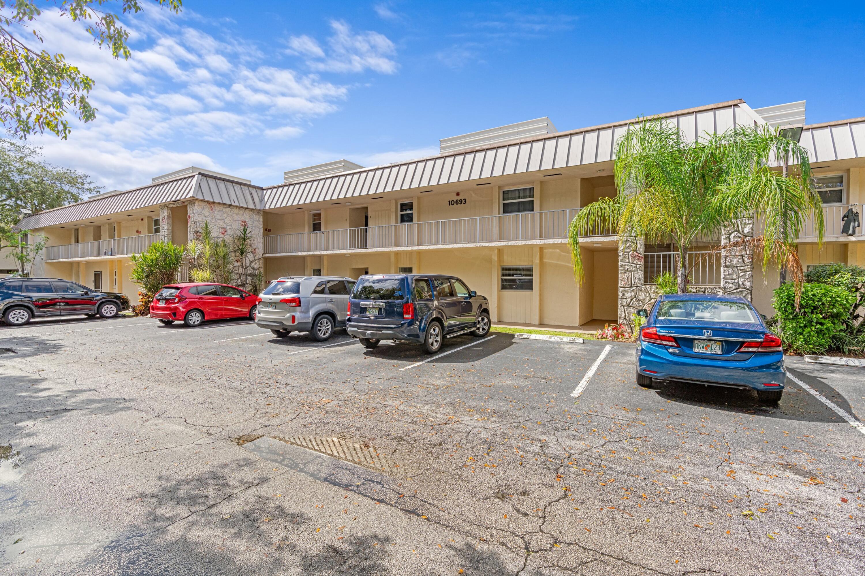 10693 North Military Trail, Unit 7 Palm Beach Gardens, FL 33410 - Photo 28 of 28 a car parked in front of a building