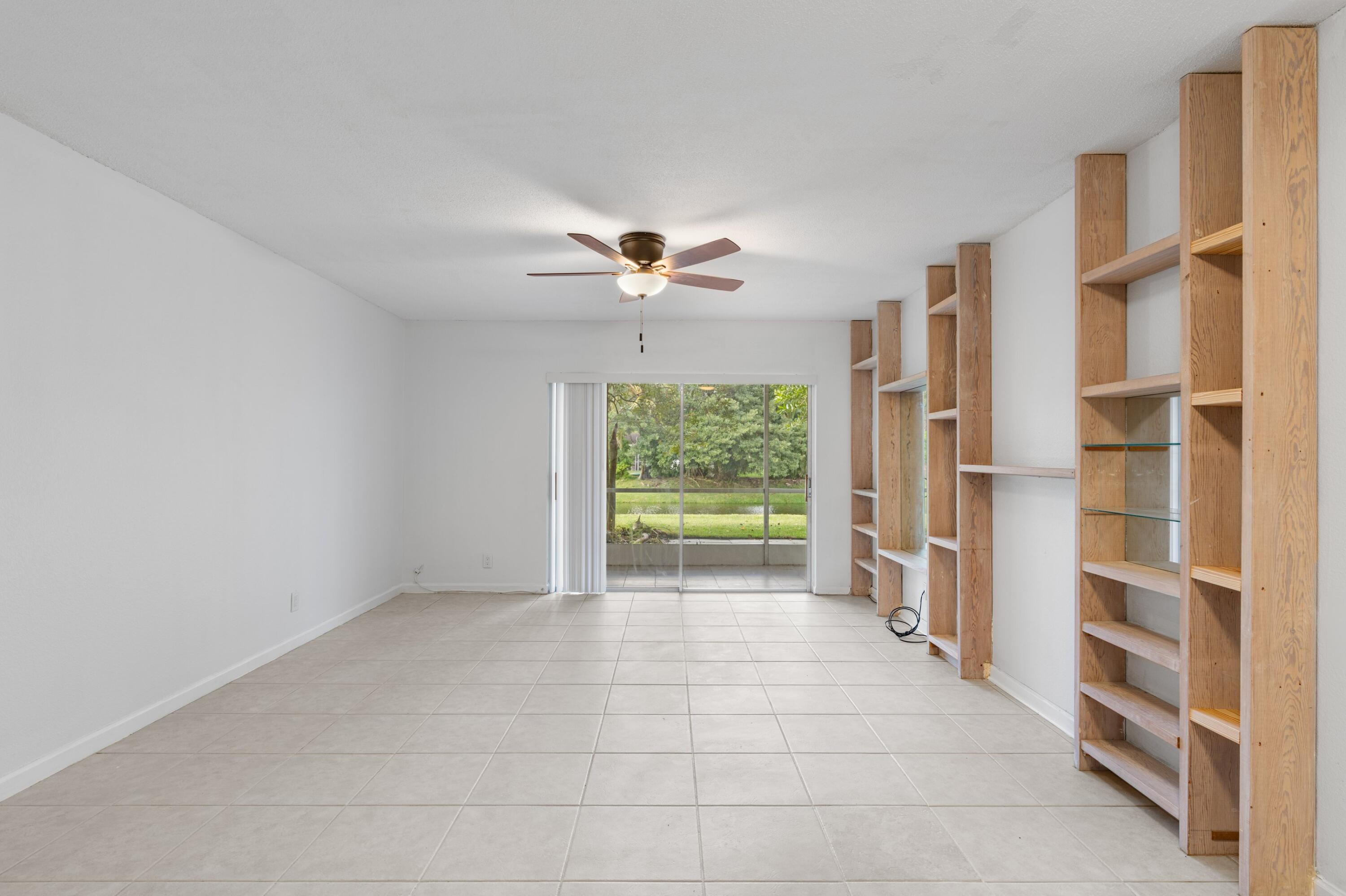 10693 North Military Trail, Unit 7 Palm Beach Gardens, FL 33410 - Photo 3 of 28 a view of an empty room with a window