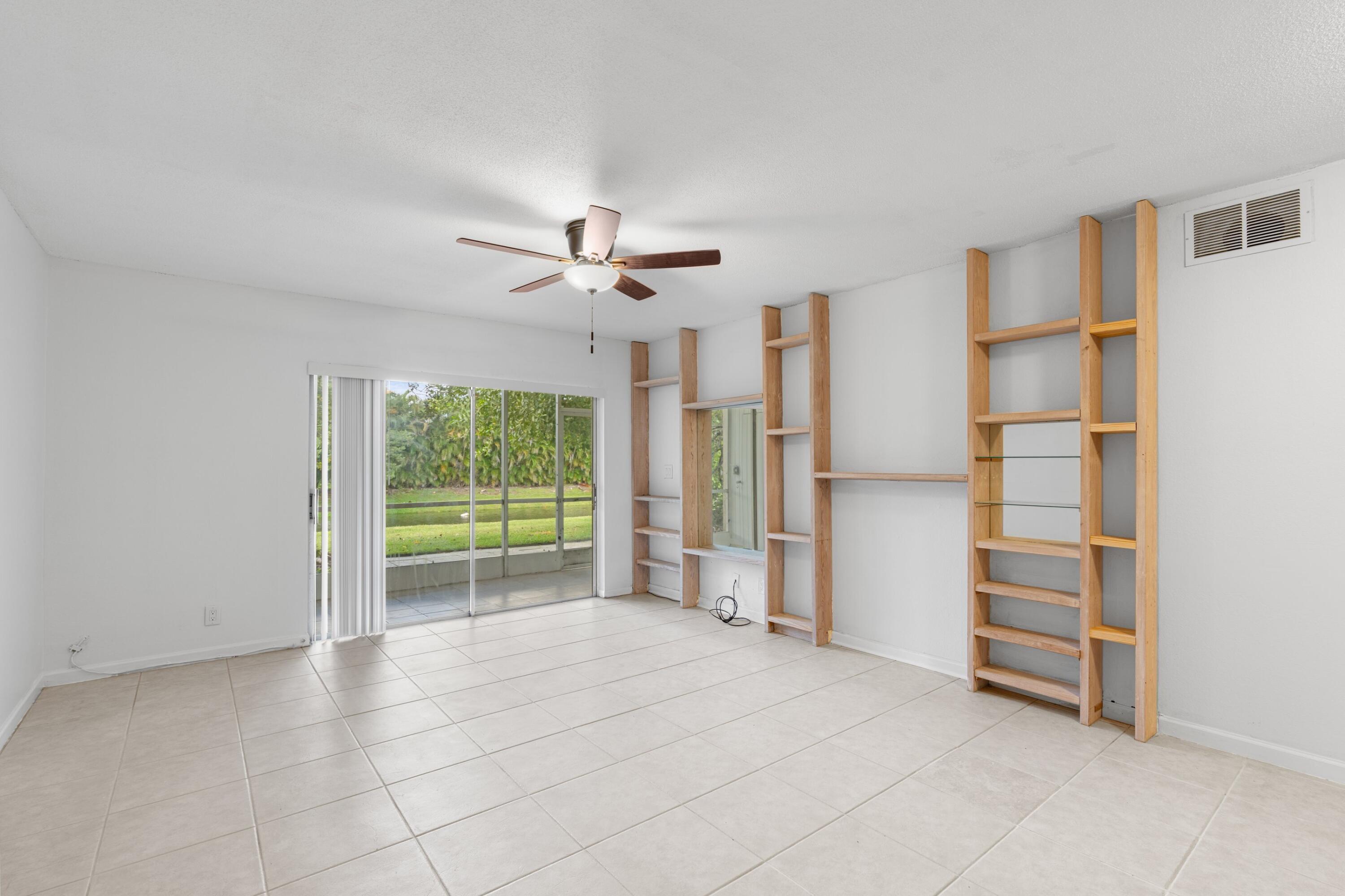 10693 North Military Trail, Unit 7 Palm Beach Gardens, FL 33410 - Photo 4 of 28 a view of an empty room with a window