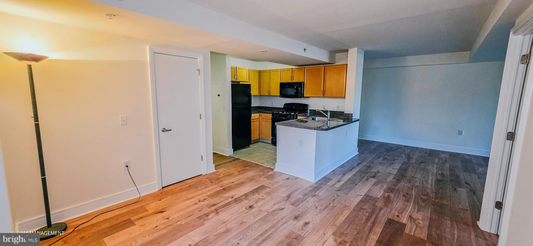 800 4th Street Southwest, Unit S402 Washington, DC 20024 - Photo 13 of 17 a kitchen with a refrigerator and a stove